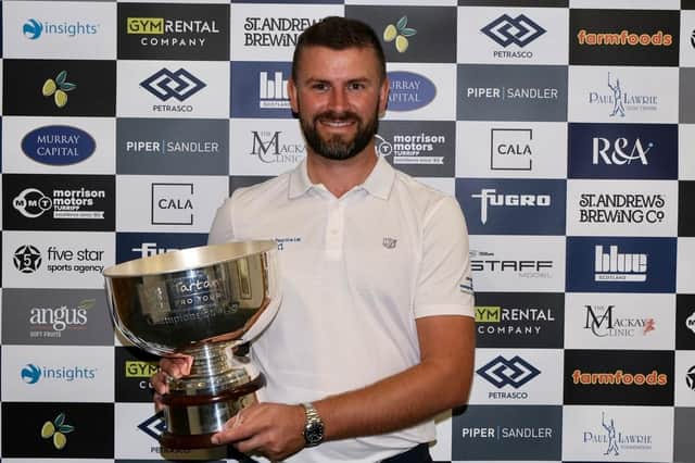 John Henry shows off the trophy after winning the Tartan Pro Tour's St Andrews Classic presented by Fugro. Picture: Tartan Pro Tour