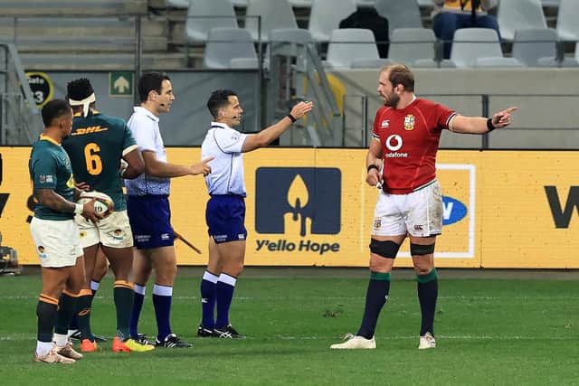 Australian referee Nic Berry, with arm raised, and his assistant Ben O'Keeffe, from New Zealand, speak to Lions captain Alun Wyn Jones during the first Test against South Africa. Picture: David Rogers/Getty Images
