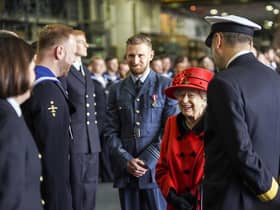 Queen Elizabeth II during a visit to HMS Queen Elizabeth at HM Naval Base, Portsmouth, ahead of the ship's maiden deployment. The visit comes as HMS Queen Elizabeth prepares to lead the UK Carrier Strike Group on a 28-week operational deployment travelling over 26,000 nautical miles from the Mediterranean to the Philippine Sea.