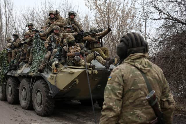 Ukrainian soldiers get ready to repel an attack in Ukraine's Lugansk yesterday (Picture: Anatolii Stepanov/AFP via Getty Images)