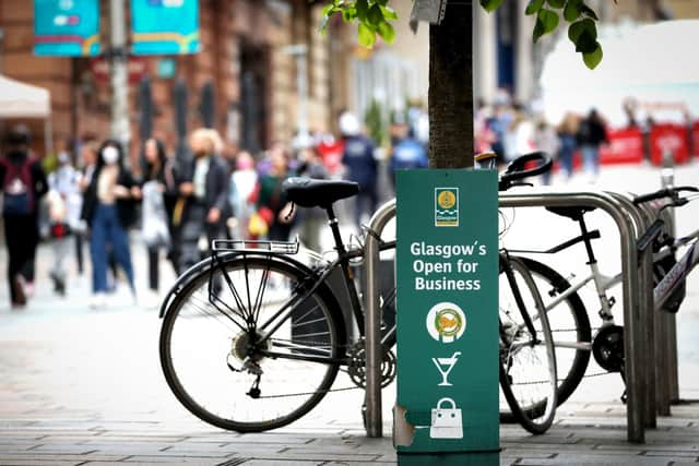 A sign reads "Glasgow's Open for Business" in Glasgow city centre. Picture: Jane Barlow/PA Wire