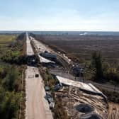 An aerial view of a road between Kharkiv and Izyum is impassable after a bridge was destroyed during fighting between Ukrainian and occupying-Russian forces, on October 08, 2022 in Izyum, Ukraine. Photo by Carl Court/Getty Images