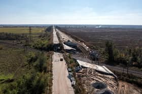 An aerial view of a road between Kharkiv and Izyum is impassable after a bridge was destroyed during fighting between Ukrainian and occupying-Russian forces, on October 08, 2022 in Izyum, Ukraine. Photo by Carl Court/Getty Images