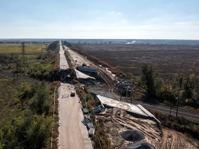 An aerial view of a road between Kharkiv and Izyum is impassable after a bridge was destroyed during fighting between Ukrainian and occupying-Russian forces, on October 08, 2022 in Izyum, Ukraine. Photo by Carl Court/Getty Images