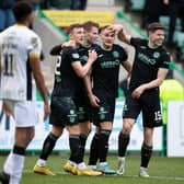 Kyle Magennis (centre) celebrates after putting Hibs 3-0 ahead over Livingston at Easter Road. (Photo by Paul Devlin / SNS Group)