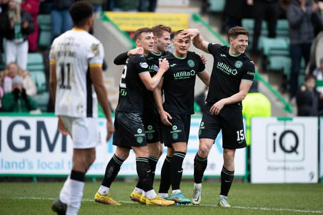 Kyle Magennis (centre) celebrates after putting Hibs 3-0 ahead over Livingston at Easter Road. (Photo by Paul Devlin / SNS Group)