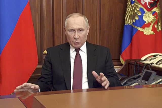 In this image made from video released by the Russian Presidential Press Service, Russian President Vladimir Putin addressees the nation in Moscow, Russia, Thursday, Feb. 24, 2022.  (Russian Presidential Press Service via AP)