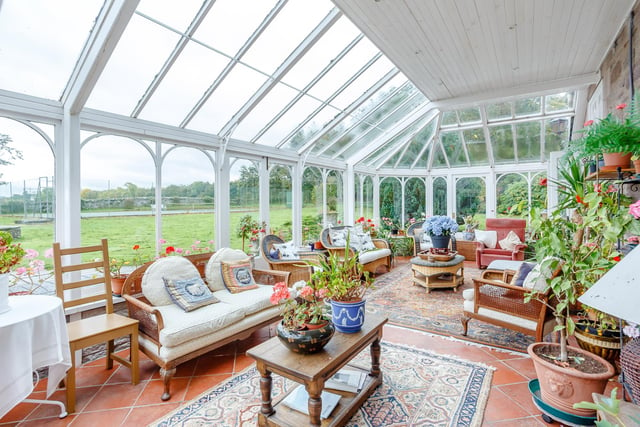 Interior: Ground-floor accommodation includes an impressive drawing room, family room, dining space and conservatory with elegant French doors. The kitchen has a breakfasting area and there is a private upstairs study. One bedroom is downstairs and the other four are upstairs.