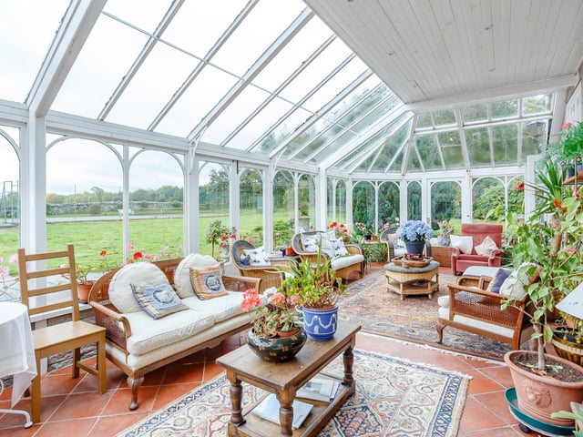 Interior: Ground-floor accommodation includes an impressive drawing room, family room, dining space and conservatory with elegant French doors. The kitchen has a breakfasting area and there is a private upstairs study. One bedroom is downstairs and the other four are upstairs.