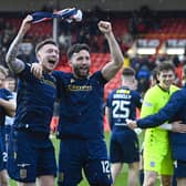 Dundee's Jordan McGhee (L) and Ricki Lamie celebrate securing top six at Pittodrie.