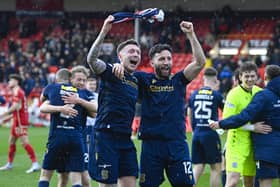 Dundee's Jordan McGhee (L) and Ricki Lamie celebrate securing top six at Pittodrie.