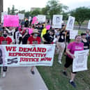 Protesters march around the Arizona Capitol after the US Supreme Court overturned the landmark Roe vs Wade abortion decision (Picture: Ross D. Franklin/AP file)