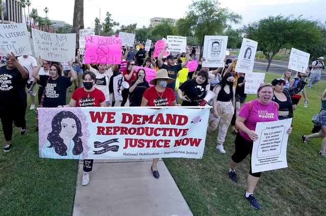 Protesters march around the Arizona Capitol after the US Supreme Court overturned the landmark Roe vs Wade abortion decision (Picture: Ross D. Franklin/AP file)