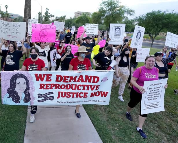 Protesters march around the Arizona Capitol after the US Supreme Court overturned the landmark Roe vs Wade abortion decision (Picture: Ross D. Franklin/AP file)