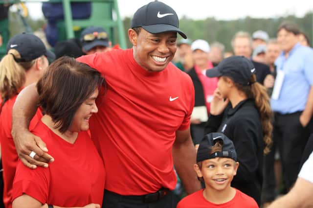 Tiger Woods celebrates his Masters win last year with son Charlie. The pair will play together at the PNC Championship next month. Picture: Andrew Redington/Getty Images