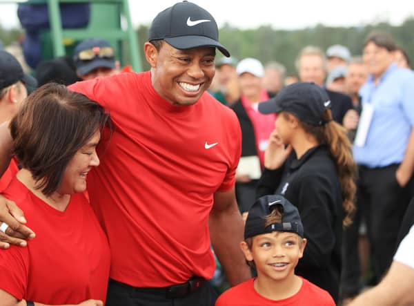 Tiger Woods celebrates his Masters win last year with son Charlie. The pair will play together at the PNC Championship next month. Picture: Andrew Redington/Getty Images