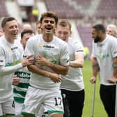Callum McGregor, centre, enjoys the title celebrations after defeating Hearts 2-0 at Tynecastle.