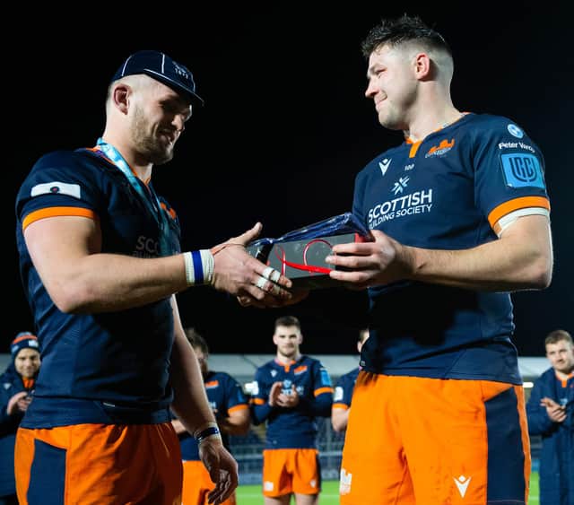 Magnus Bradbury is presented with a cap to mark his 100th Edinburgh appearance by club co-captain Grant Gilchrist after the win over Benetton.  (Photo by Ross Parker / SNS Group)