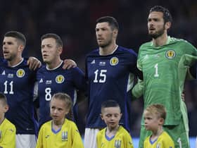 Scott McKenna joins Craig Gordon on the sidelines after fracturing his collarbone playing for Nottingham Forest.  (Photo by Craig Williamson / SNS Group)