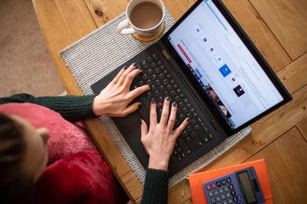 A woman works from her laptop from a remote office. Picture: PA