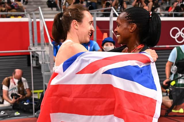 Gold medallist Faith Kipyegon of Kenya with silver medallist, Laura Muir. (Photo by Dylan Martinez - Pool / Getty Images)