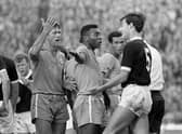 Brazil's Pele (centre) remonstrates with Scotland's Ronnie MacKinnon (right) following a clash with Billy Bremner (left background) during a friendly at Hampden, June 25, 1966.