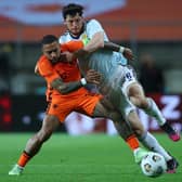 Scotland defender Scott McKenna battles for possesion with Netherlands forward Memphis Depay during the last meeting between the sides in 2021. (Photo by Fran Santiago/Getty Images)