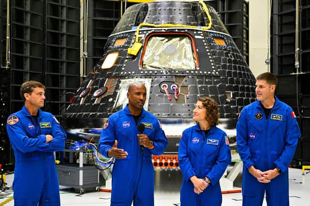 The crew of Artemis II in front of the Artemis II crew module at the Kennedy Space Center in Cape Canaveral, Florida, earlier this year.