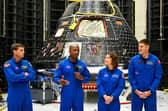 The crew of Artemis II in front of the Artemis II crew module at the Kennedy Space Center in Cape Canaveral, Florida, earlier this year.