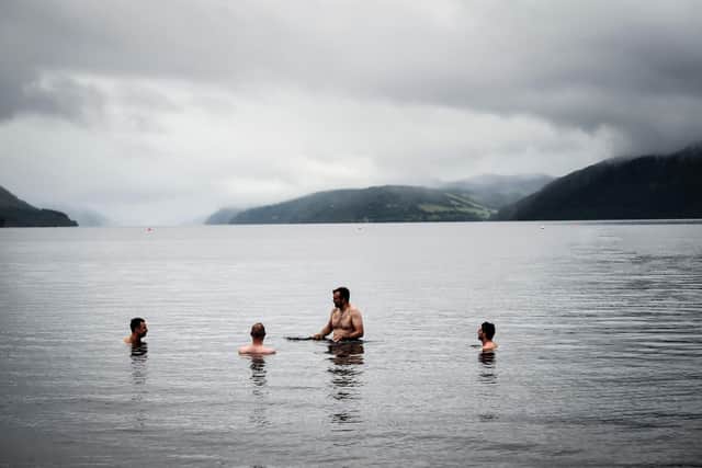 People swim off Dores Beach at Loch Ness. The biggest search for the Loch Ness Monster in five decades got underway in the Scottish Highlands. Picture: Andy Buchanan