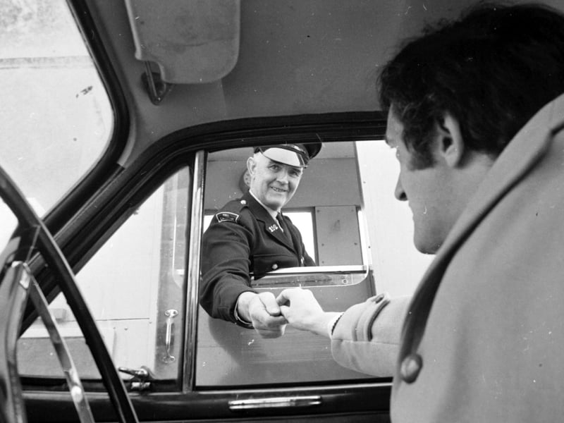 Anthony Troon pays his half crown at the toll barrier on the Forth Road Bridge