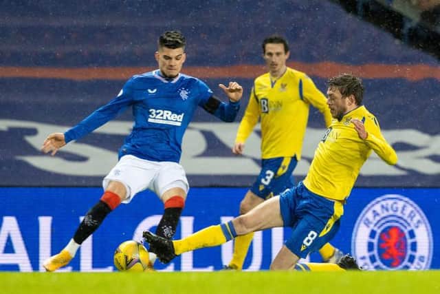 Rangers' Ianis Hagi (L) is tackled by St Johnstone's Murray Davidson during the Scottish Premiership match between Rangers and St Johnstone at Ibrox Stadium, on February 03, 2021, in Glasgow, Scotland. (Photo by Alan Harvey / SNS Group)