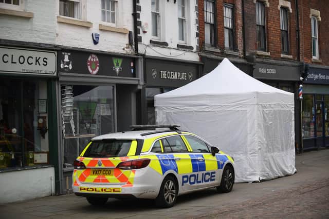 Police activity at The Clean Plate cafe in Southgate Street, Gloucester. (Picture credit: Joe Giddens/PA Wire)