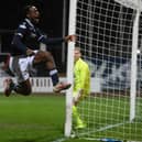 Striker Zach Robinson celebrates putting Dundee 2-0 up at Dens Park.