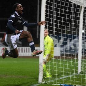 Striker Zach Robinson celebrates putting Dundee 2-0 up at Dens Park.