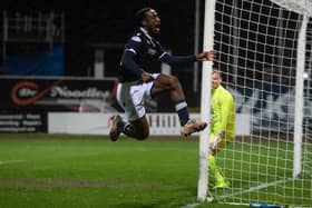 Striker Zach Robinson celebrates putting Dundee 2-0 up at Dens Park.