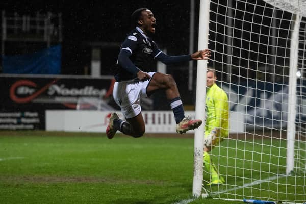 Striker Zach Robinson celebrates putting Dundee 2-0 up at Dens Park.