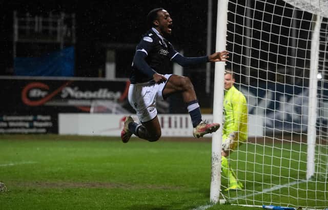 Striker Zach Robinson celebrates putting Dundee 2-0 up at Dens Park.