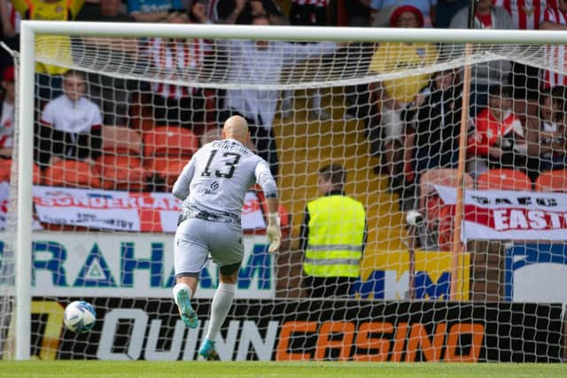 Dundee United's Charlie Mulgrew's back pass goes past Carljohan Eriksson during a pre-season friendly against Sunderland.