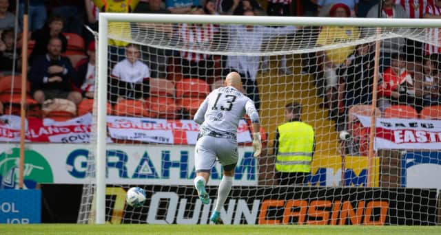 Dundee United's Charlie Mulgrew's back pass goes past Carljohan Eriksson during a pre-season friendly against Sunderland.