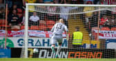 Dundee United's Charlie Mulgrew's back pass goes past Carljohan Eriksson during a pre-season friendly  against Sunderland.