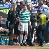 25/04/04 SPL
HEARTS V CELTIC
TYNECASTLE PARK - EDINBURGH.
Celtic assistant managerJohn Robertson (left) tells Celtic youngster Aiden McGeady (centre) to salute the fans after he scored on his debut.