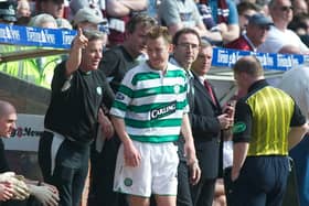 25/04/04 SPL
HEARTS V CELTIC
TYNECASTLE PARK - EDINBURGH.
Celtic assistant managerJohn Robertson (left) tells Celtic youngster Aiden McGeady (centre) to salute the fans after he scored on his debut.