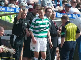 25/04/04 SPL
HEARTS V CELTIC
TYNECASTLE PARK - EDINBURGH.
Celtic assistant managerJohn Robertson (left) tells Celtic youngster Aiden McGeady (centre) to salute the fans after he scored on his debut.