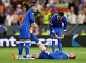 Rangers captain James Tavernier helps out John Lundstram with cramp during the Europa League final match against Eintracht Frankfurt. (Photo by Alex Pantling/Getty Images)