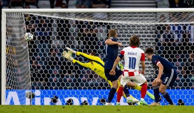 Croatian captain Luke Modric guides a stunning shot beyond helpless Scotland goalkeeper David Marshall at Hampden. (Photo by Craig Williamson / SNS Group)