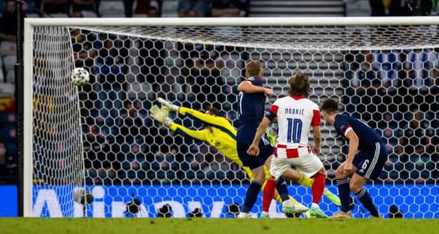 Croatian captain Luke Modric guides a stunning shot beyond helpless Scotland goalkeeper David Marshall at Hampden. (Photo by Craig Williamson / SNS Group)