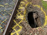 Network Rail engineers are working to repair a section of the line between Kilmarnock and Barassie after a large hole appeared close to the tracks.