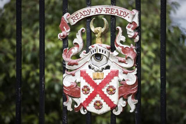 The school crest and motto on the entrance gate to the Merchiston School