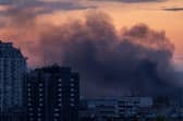 Smoke rises after Russian missiles hit Kyiv on Thursday (Picture: John Moore/Getty Images)